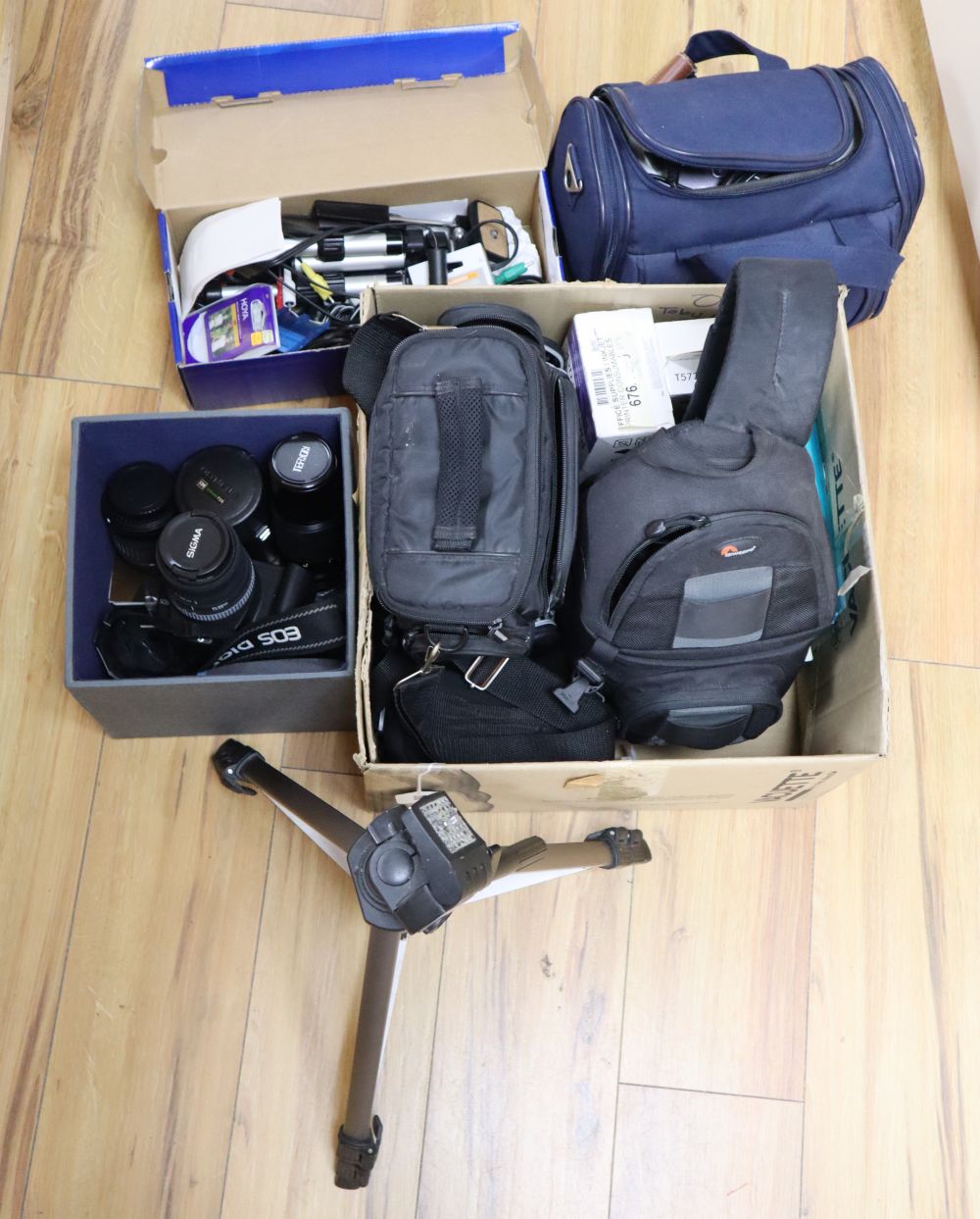 Assorted camera equipment to include a Canon EOS350D with Sigma 55 200 mm lens, a Canon 18-55mm lens, Tefnon 100-200mm lens, photo